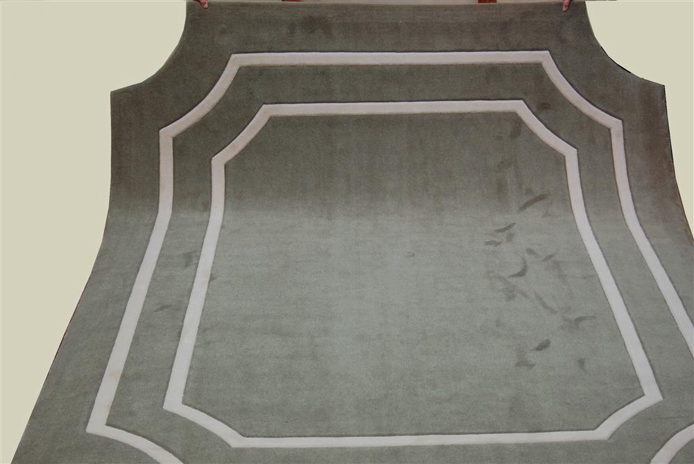 Appraisal: BROADLOOM NYLON RUG having carved borders a field of sage