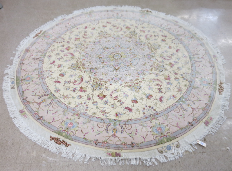 Appraisal: A CONTEMPORARY ROUND PERSIAN WOOL AND SILK CARPET hand knotted