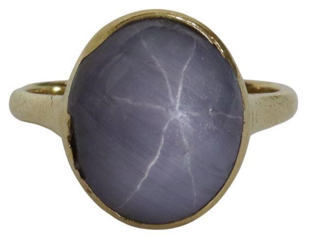 Appraisal: Estate kt yellow gold ring bezel-set star sapphire oval cabochon