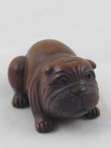 Appraisal: A signed wood netsuke in the form of a Pekinese