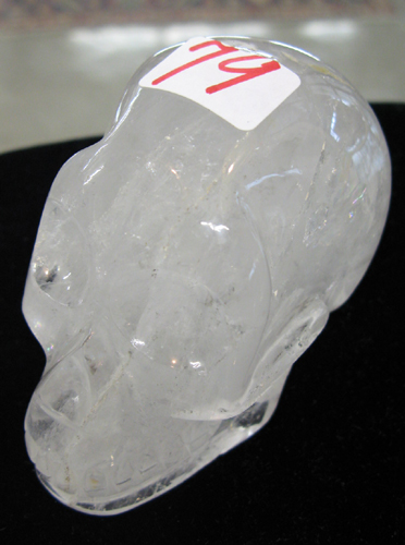 Appraisal: A NATURAL ROCK CRYSTAL SCULPTURE PAPERWEIGHT of a human skull