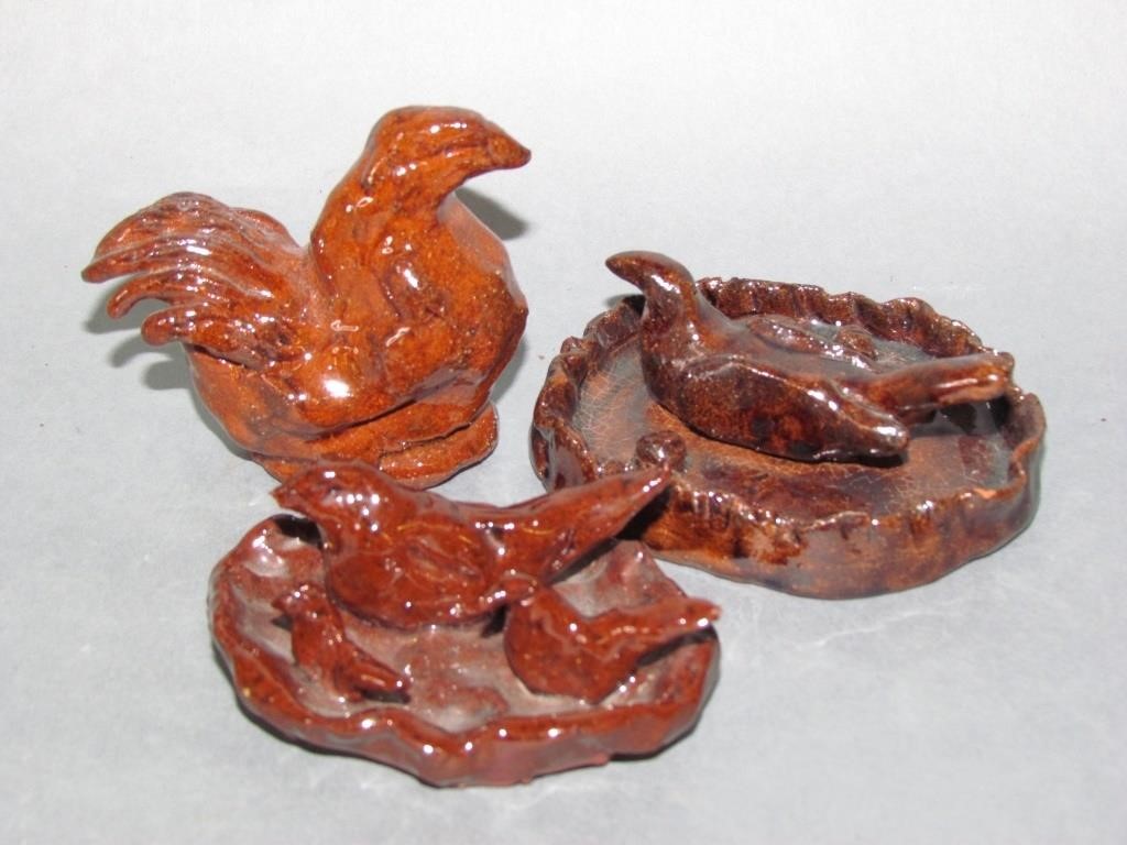 Appraisal: R Foltz hen no damage R Foltz three bird figurines