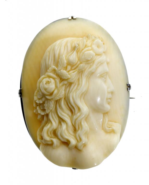 Appraisal: A VICTORIAN IVORY OVAL CAMEO carved with the head of