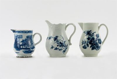 Appraisal: Two Worcester blue and white jugs one feather moulded painted