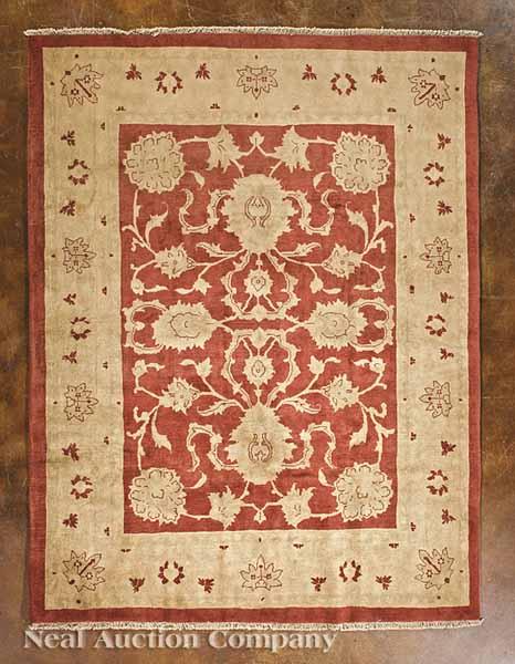 Appraisal: A Persian Sultanabad Carpet rust central field cream border stylized