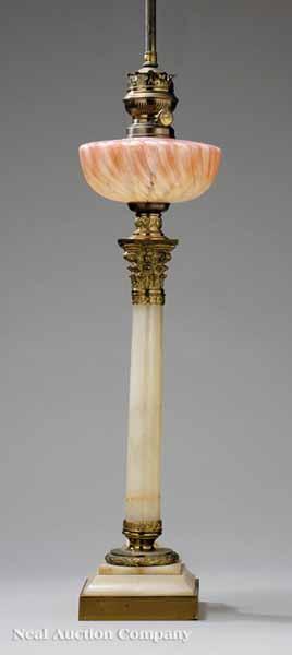 Appraisal: A French Alabaster Brass and Glass Oil Lamp in the