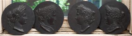 Appraisal: Set of four allegorical carved relief roundels th century