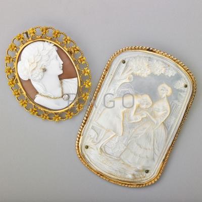 Appraisal: TWO K GOLD MOUNTED CAMEO BROOCHES Highly detailed and large