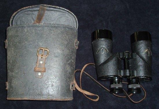 Appraisal: A pair of cased binoculars marked REL Canada