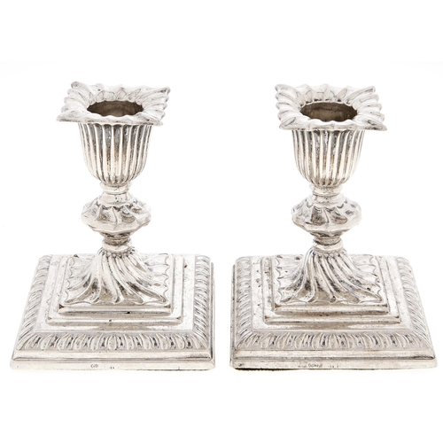 Appraisal: A pair of Victorian dwarf silver candlesticks wrythen fluted on