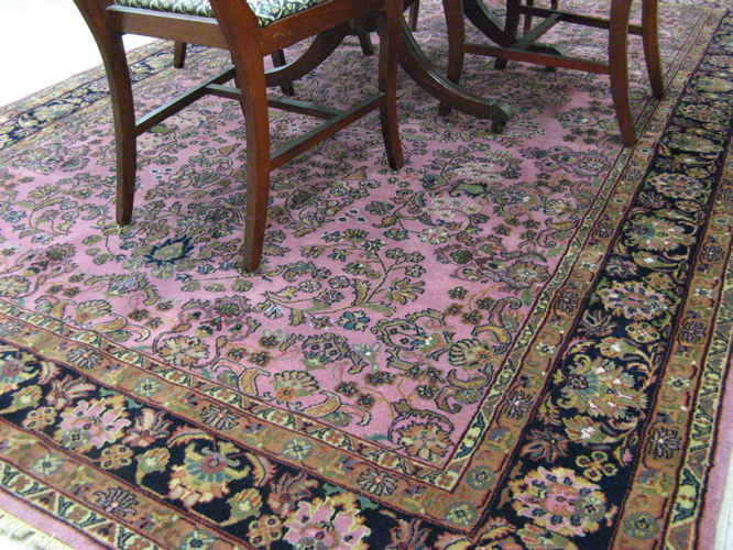 Appraisal: HAND KNOTTED ORIENTAL CARPET Persian Sarouk design overall floral decoration