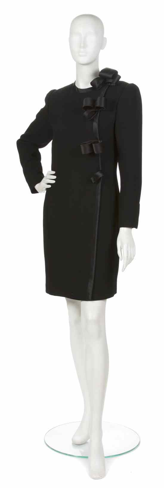 Appraisal: An Andre Laug Black Wool Crepe Dress satin trim and