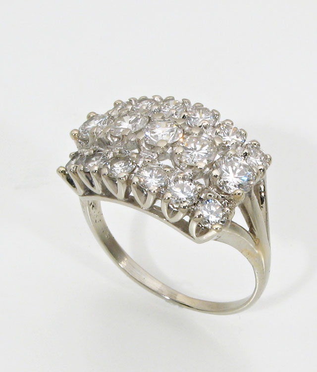 Appraisal: DIAMOND AND FOURTEEN KARAT WHITE GOLD CLUSTER RING the rectangular-shaped