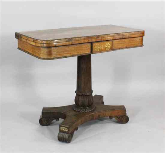 Appraisal: A Regency brass inset rosewood card table with folding top