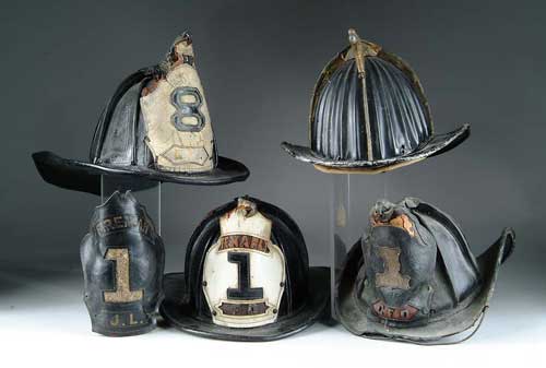 Appraisal: FOUR ANTIQUE FIRE HELMETS Leather front marked Tenafly F D