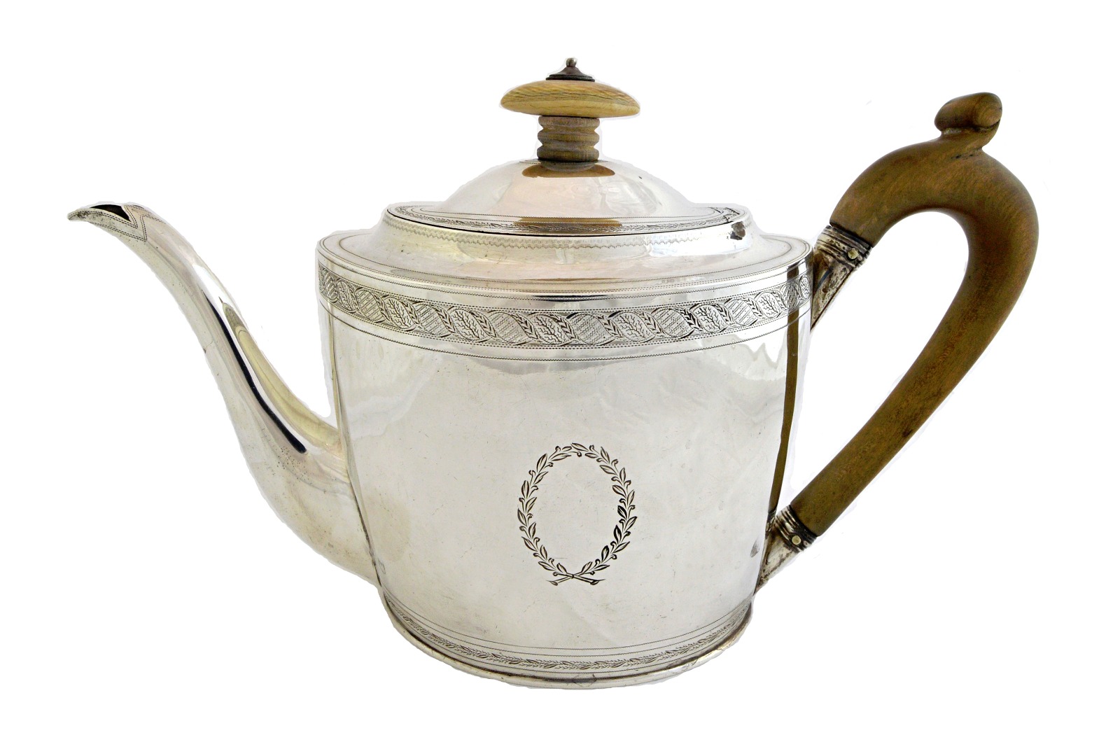 Appraisal: A George III silver teapot of tapering oval form decorated