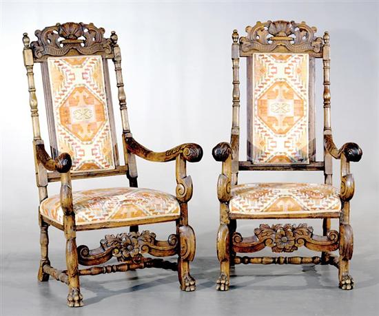 Appraisal: Pair Continental carved and upholstered armchairs th century high-back frame