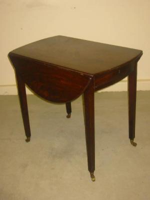 Appraisal: A GEORGE III MAHOGANY PEMBROKE TABLE of oval form with