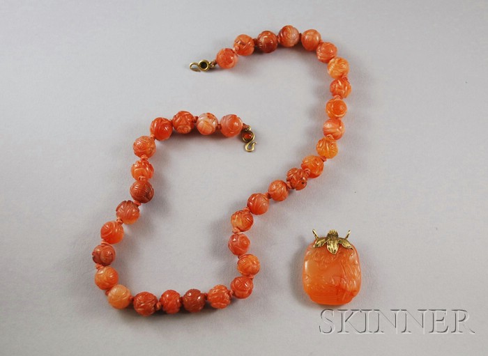 Appraisal: kt Gold and Carved Carnelian Beaded Necklace and Pendant lg