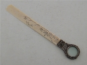 Appraisal: A Victorian silver-mounted ivory combination paper knife and magnifying glass