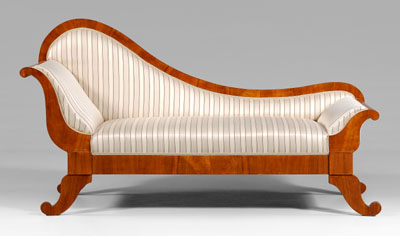 Appraisal: Biedermeier style fruitwood recamier arched back and scrolled head and