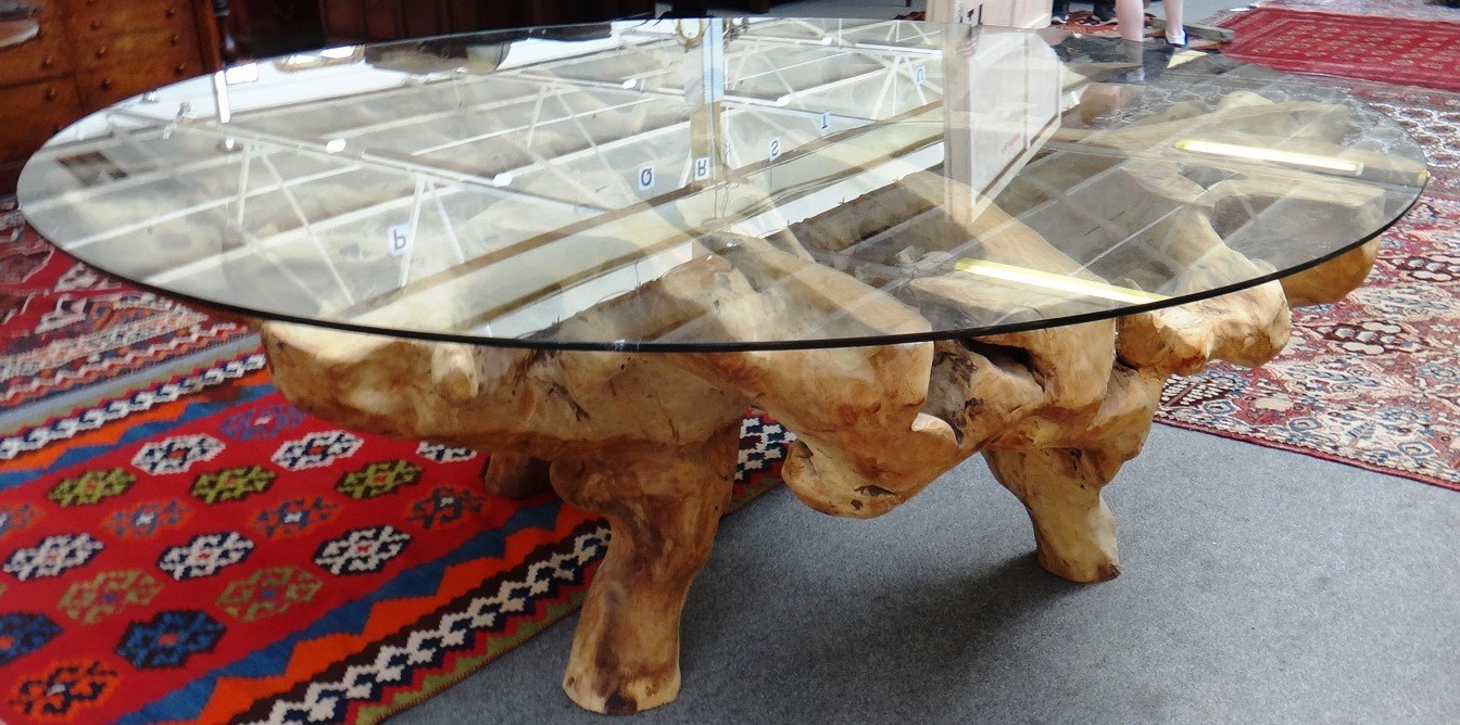 Appraisal: A th century root table the circular plate glass top