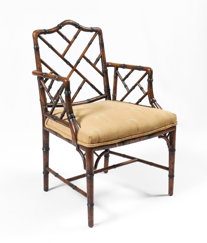 Appraisal: CARVED FAUX BAMBOO ARM CHAIR Carved faux bamboo frame palm