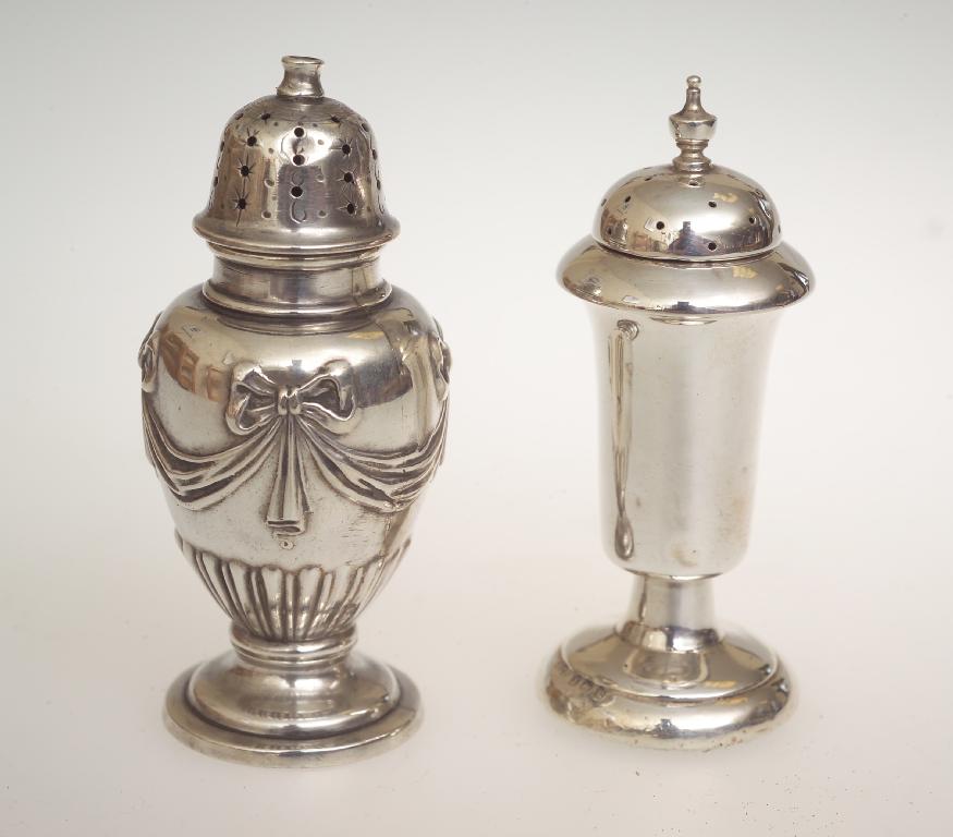 Appraisal: TWO SILVER PEPPERETTES the first Sheffield decorated with ribbon-tied swags