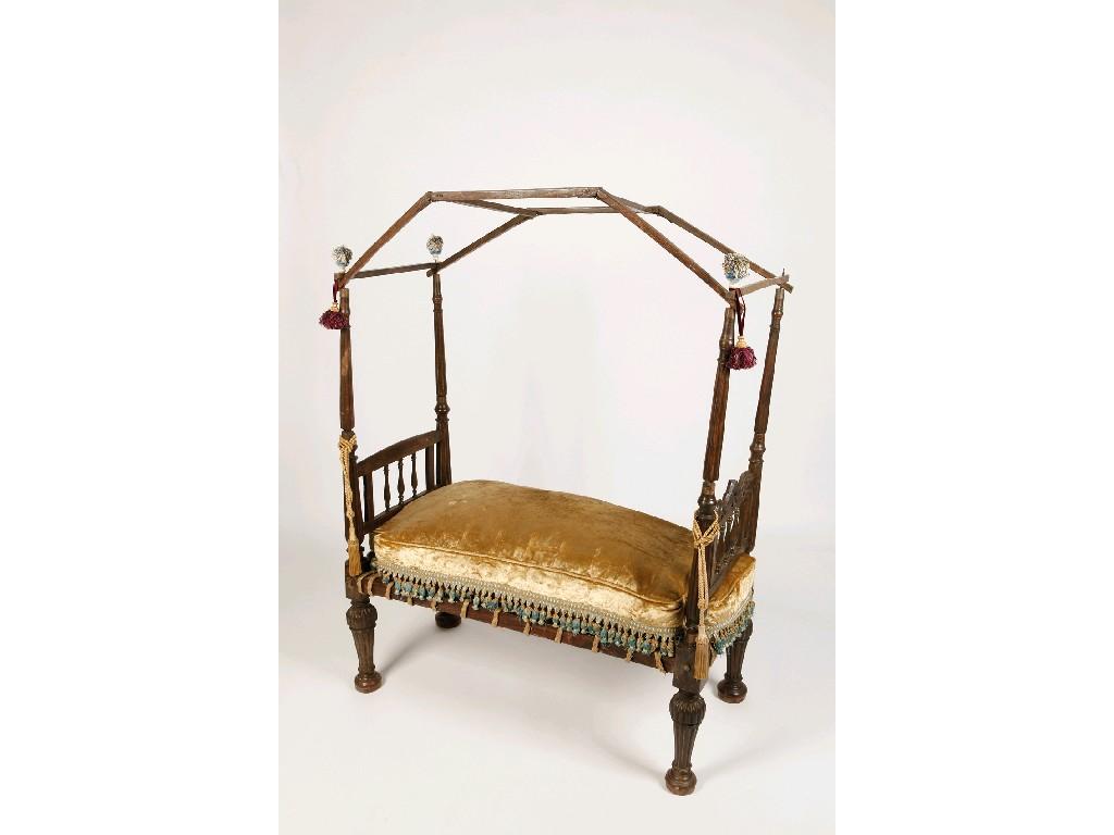 Appraisal: AN INDIAN CHILD'S BED with raised canopy with tapering reeded