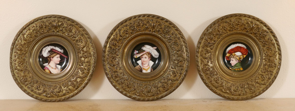 Appraisal: MINIATURE PAINTED PORCELAIN PLAQUES Portraits of Young Women Wearing Plumed