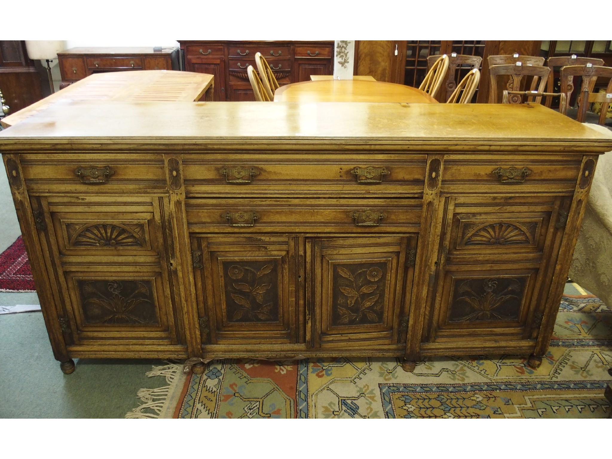 Appraisal: A Victorian carved oak sideboard with brass handles x x