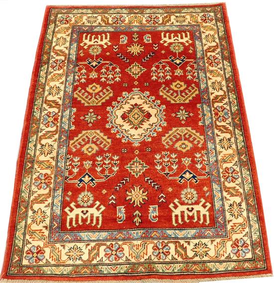 Appraisal: RUG Uzbek Kazak scatter rug geometric and floral motifs red