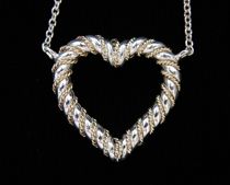 Appraisal: Tiffany Co Sterling Silver and Gold Heart Pendant with Chain