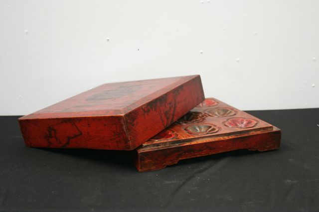 Appraisal: A wooden Chinese moon cake box with lid the interior