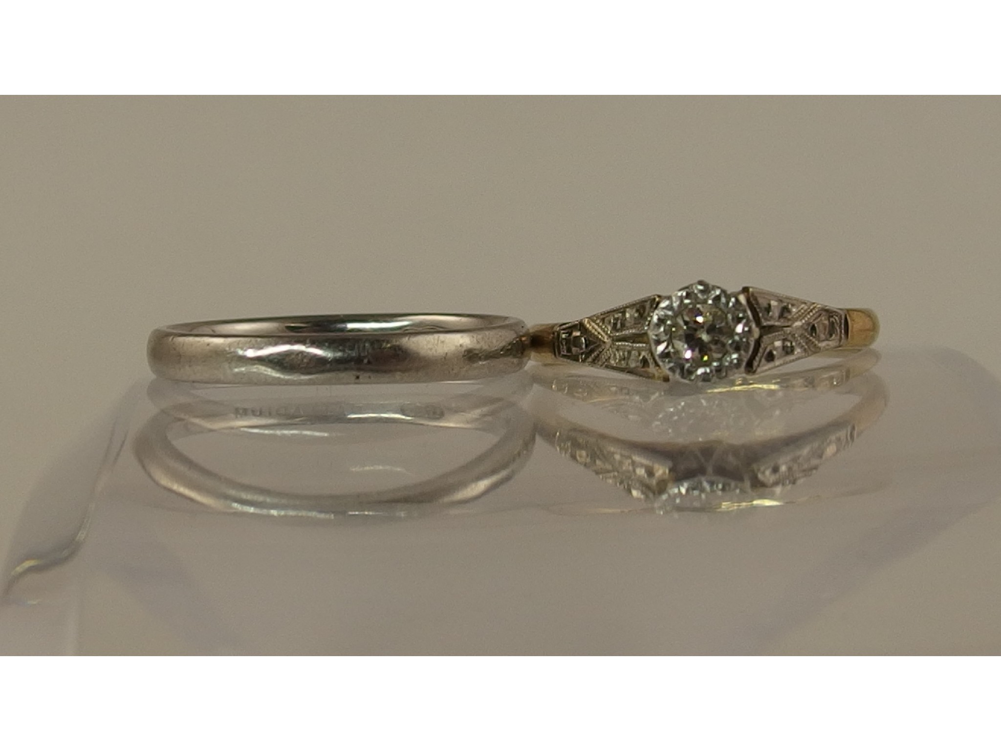 Appraisal: A palladium wedding band and an ct diamond solitaire