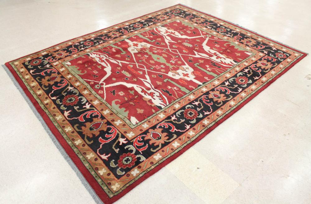 Appraisal: HAND KNOTTED ORIENTAL CARPET Indo-Persian stylized floral curvilinear design on