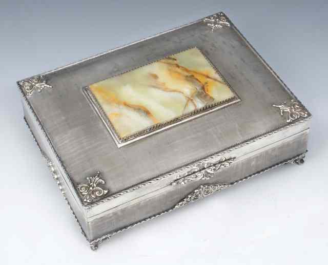 Appraisal: A CONTINENTAL SILVER CIGAR BOX decorated with rope twist borders