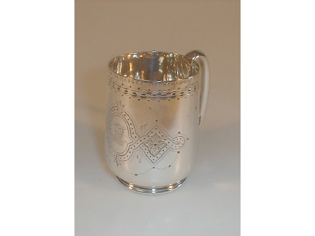 Appraisal: A Victorian silver tankard of plain bellied form engraved with