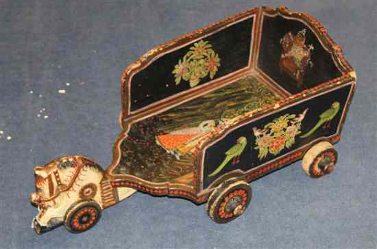 Appraisal: A late th century Indian painted pine child's chariot decorated