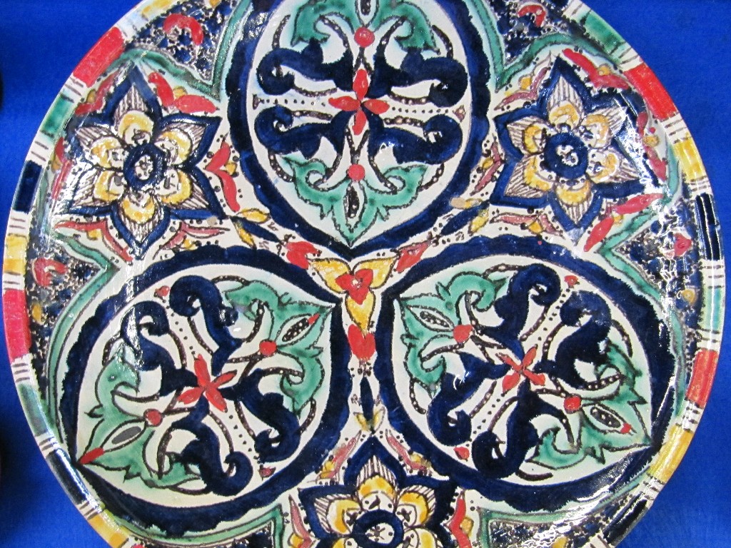 Appraisal: Islamic pottery dish with multicoloured painted decoration