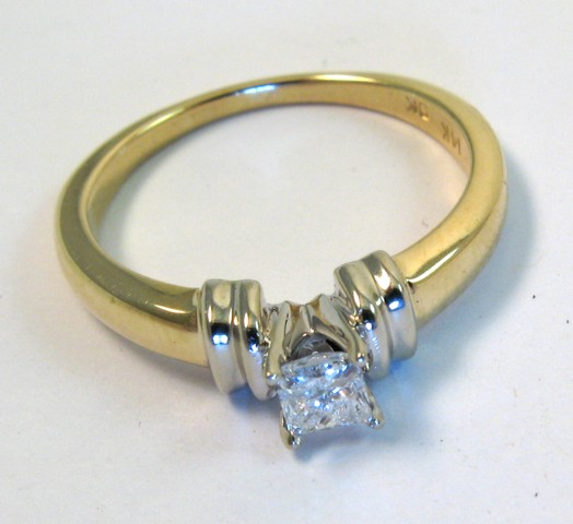 Appraisal: DIAMOND AND FOURTEEN KARAT GOLD RING set with a princess-cut