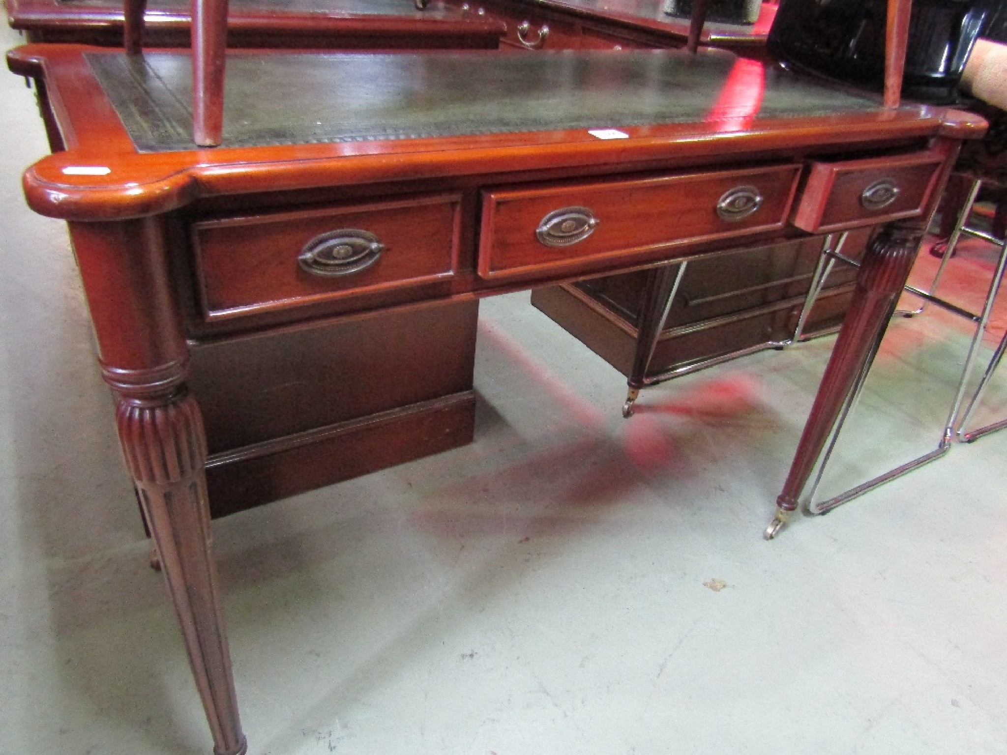 Appraisal: A good quality reproduction mahogany writing table of rectangular form