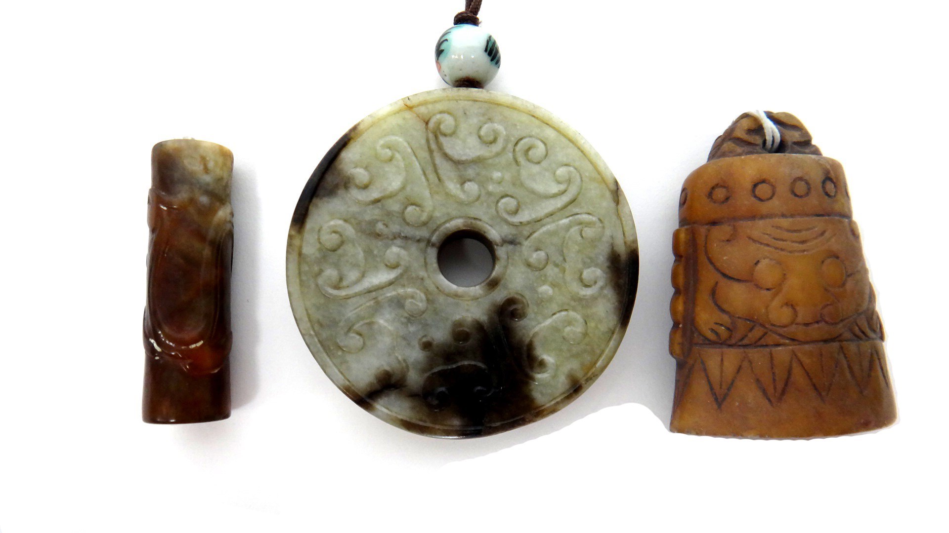 Appraisal: Three jade carvings th century and later comprising a double