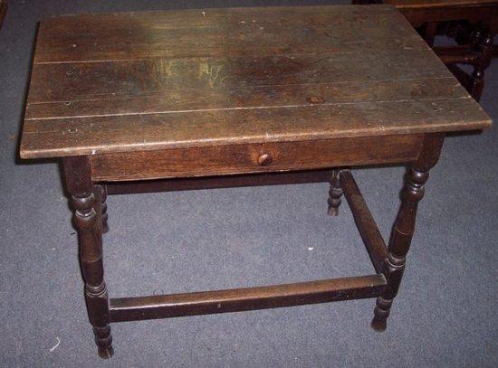 Appraisal: A rectangular oak table fitted a drawer on baluster turned