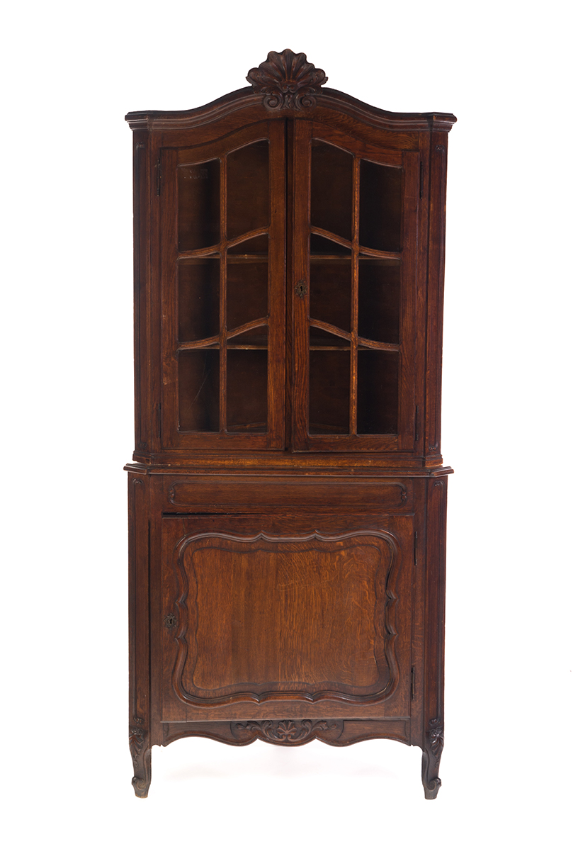 Appraisal: FRENCH-STYLE TWO-PIECE CORNER CUPBOARD European th century oak Scrolled foliage