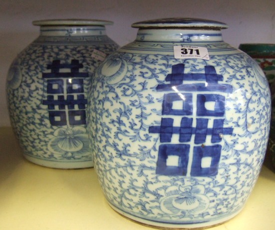 Appraisal: Two Chinese Provincial blue and white jars and covers painted