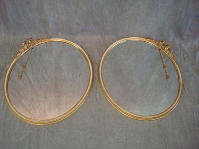 Appraisal: Pair giltwood oval mirrors w bow crown tassels Slight loss