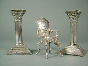 Appraisal: A pair of Edwardian miniature silver corinthean column candlesticks birmingham