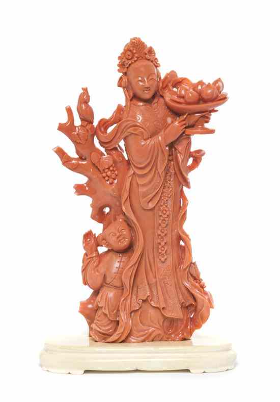 Appraisal: A Fine Chinese Carved Coral Figure with Ivory Base depicting