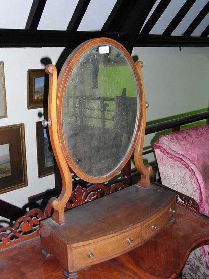 Appraisal: A TH CENTURY MAHOGANY INLAID DRESSING TABLE MIRROR with shaped